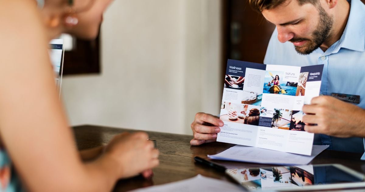 Man showing brochure