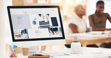 Looking at website with people in the background