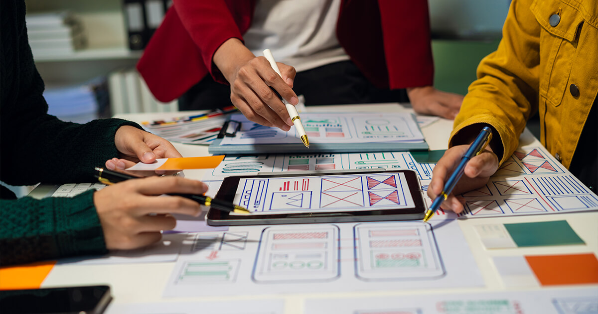 Website design team strategising about layout and user experience