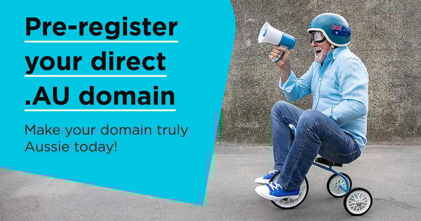 Middle-aged man in blue sits on blue tricycle with blue megaphone smiling