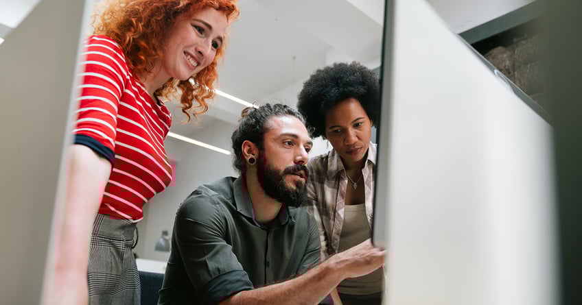 Team looking at website to try find revenue opportunities