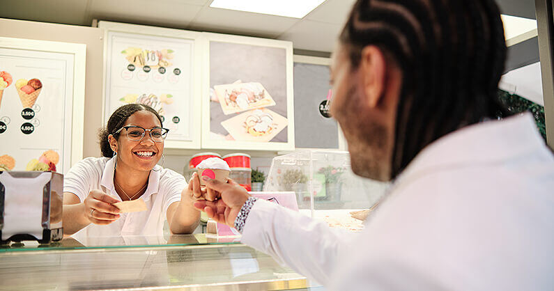 Woman serving ice cream using brand consistency
