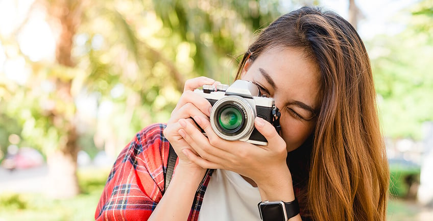 A person taking a photo with a camera