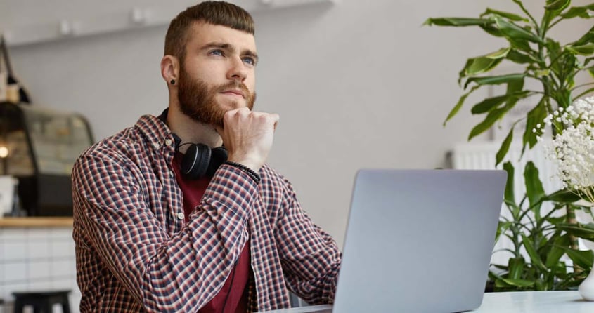 Young Man thinking about web design